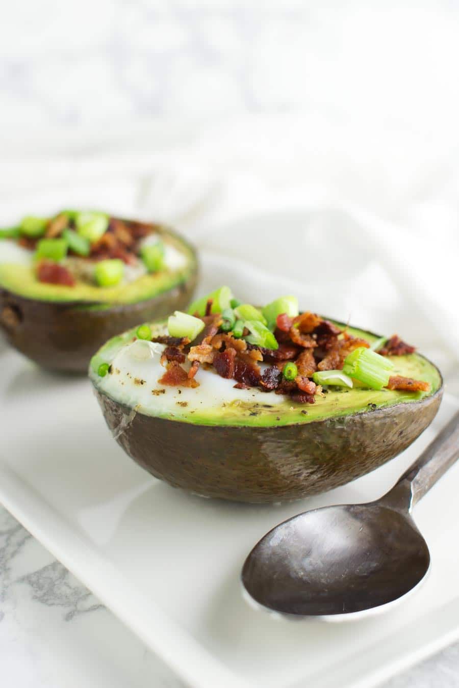 Baked Eggs in Avocados recipe from acleanplate.com #paleo #grainfree #glutenfree