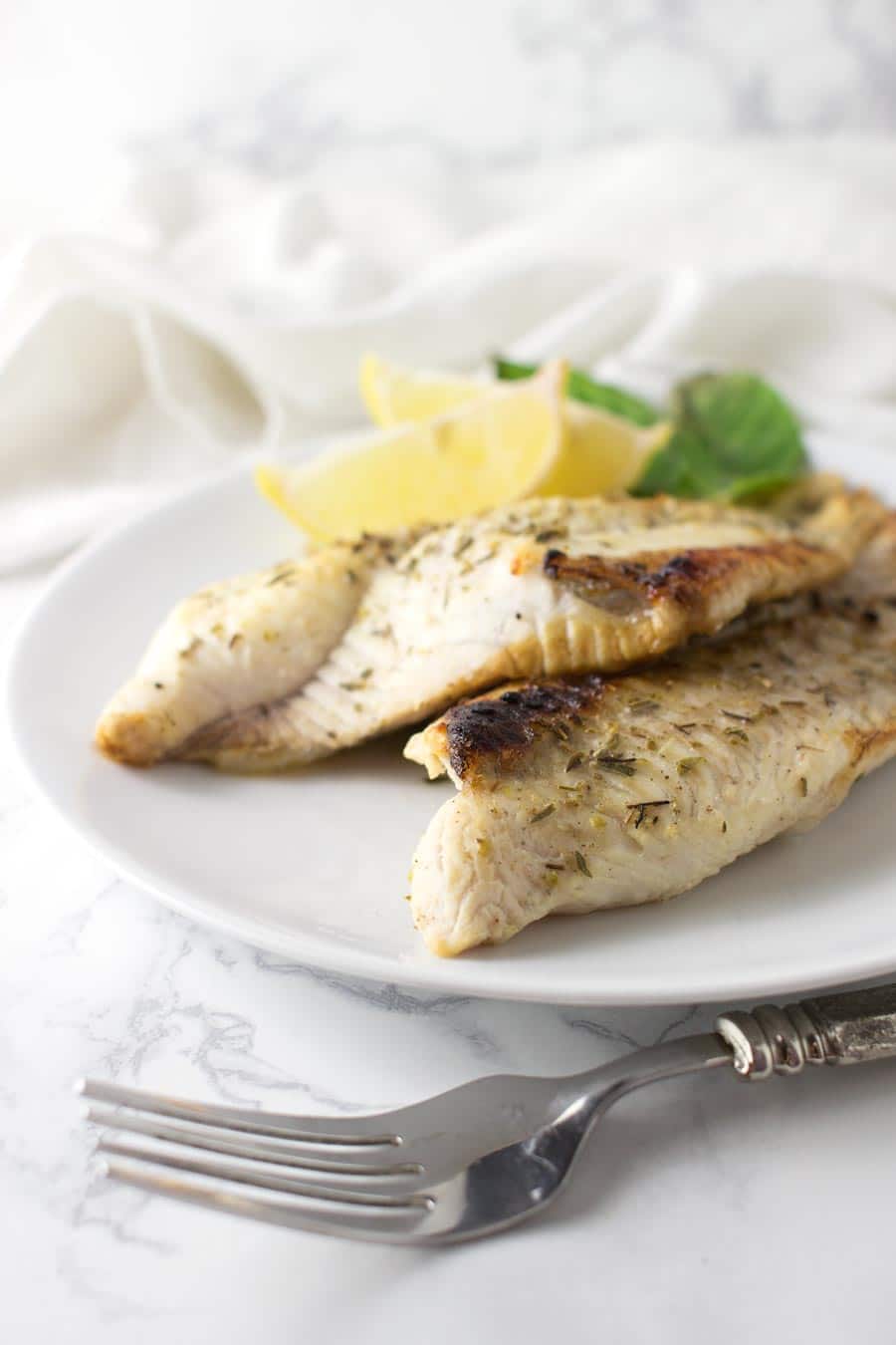 Garlic and Herb Catfish recipe from acleanplate.com #aip #paleo #autoimmuneprotocol