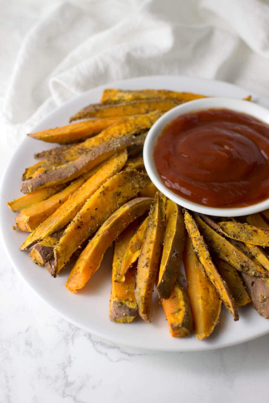 Garlic Herb Sweet Potato Fries recipe from acleanplate.com #aip #paleo #autoimmuneprotocol