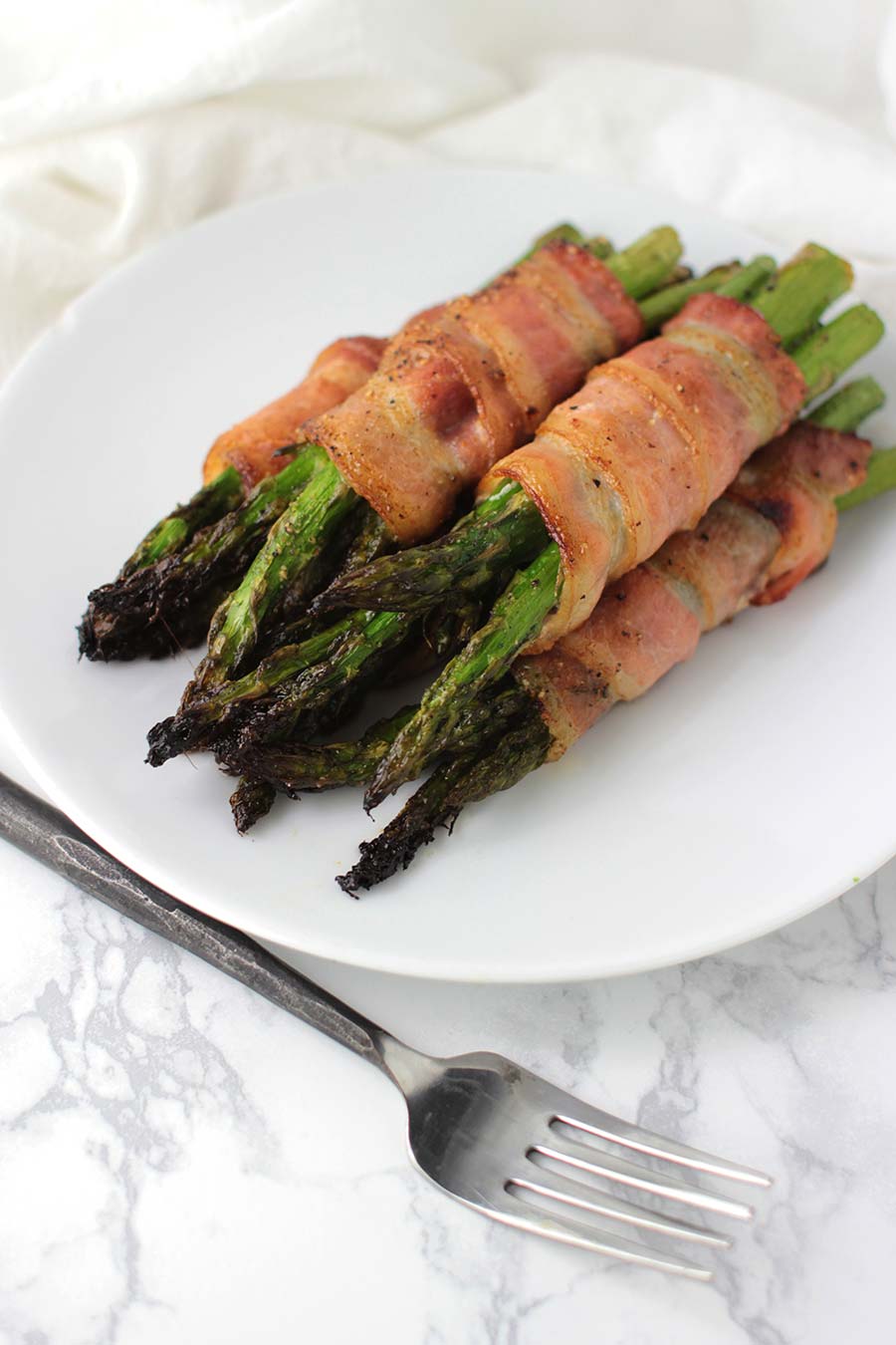Bacon-Wrapped Asian Asparagus recipe from acleanplate.com #aip #autoimmuneprotocol #paleo