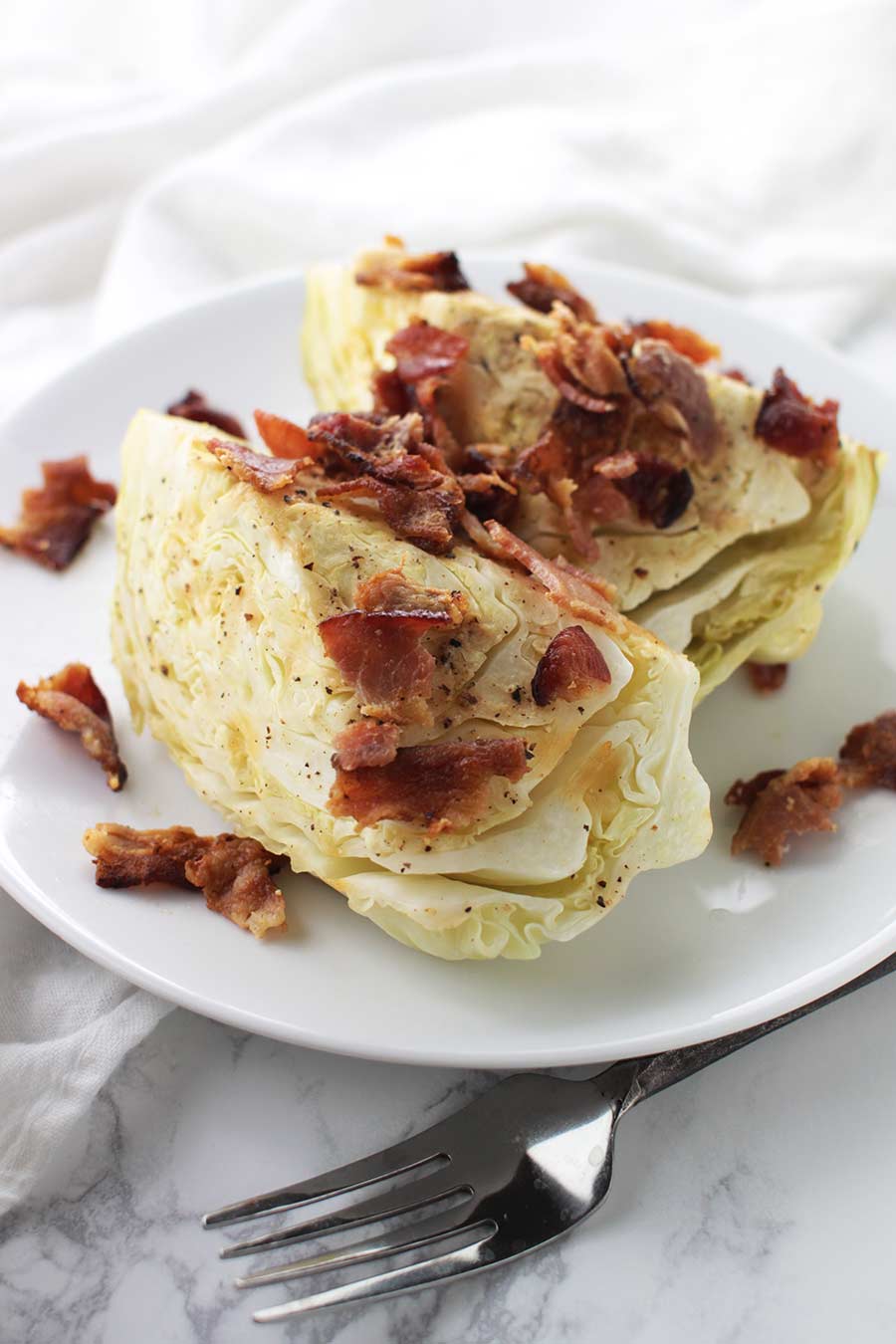 Garlic-Bacon Cabbage recipe from acleanplate.com #aip #autoimmuneprotocol #paleo