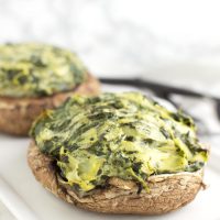 Spinach and Artichoke Stuffed Mushrooms recipe from acleanplate.com #paleo #aip #autoimmuneprotocol