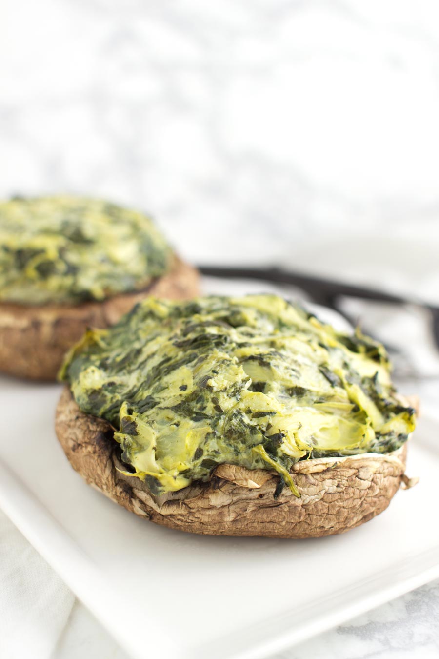 Spinach and Artichoke Stuffed Mushrooms recipe from acleanplate.com #paleo #aip #autoimmuneprotocol